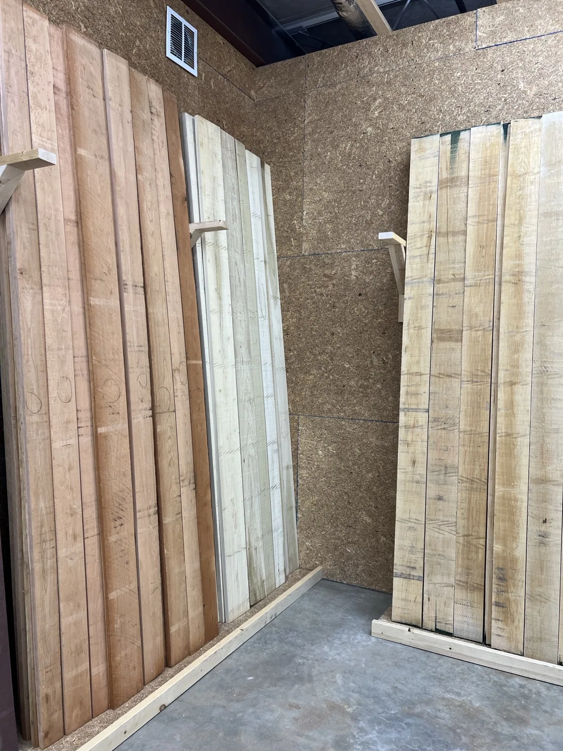 Hardwood showroom aisle with upright lumber racks